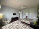 Bright bedroom featuring two beds and built-in dresser at 7762 Linkside Loop, Reunion, FL 34747