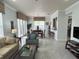 Dining area with seating for six, adjacent to living room at 7762 Linkside Loop, Reunion, FL 34747