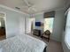 Main bedroom featuring a king bed and access to a balcony at 7762 Linkside Loop, Reunion, FL 34747