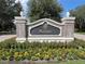 Brick community sign with the name Reunion in elegant lettering at 7762 Linkside Loop, Reunion, FL 34747