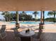 Resort-style pool with lounge chairs and covered seating at 7762 Linkside Loop, Reunion, FL 34747
