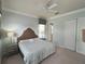 Bright bedroom with a king-size bed and en-suite bathroom access at 7762 Linkside Loop, Reunion, FL 34747