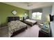 Two double beds, ceiling fan, and view of backyard from window at 7762 Linkside Loop, Reunion, FL 34747