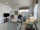 Spacious living room with ample natural light and comfortable seating at 7762 Linkside Loop, Reunion, FL 34747