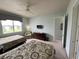 Two double beds, ceiling fan, and access to bathroom at 7762 Linkside Loop, Reunion, FL 34747