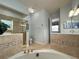 Spa-like bathroom with a corner tub and walk-in shower at 7762 Linkside Loop, Reunion, FL 34747