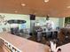 Community clubhouse bar with TVs and seating at 7762 Linkside Loop, Reunion, FL 34747