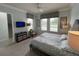 Spacious bedroom with large windows and plush carpeting at 7762 Linkside Loop, Reunion, FL 34747