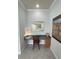 Home office with built-in desk and ample natural light at 7762 Linkside Loop, Reunion, FL 34747