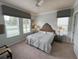 Spacious main bedroom with ceiling fan and large windows at 7762 Linkside Loop, Reunion, FL 34747