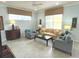 Living room with beige sofa and two armchairs at 7762 Linkside Loop, Reunion, FL 34747
