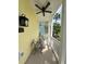 Front porch with seating area and ceiling fan at 7762 Linkside Loop, Reunion, FL 34747