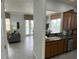 Kitchen with stainless steel appliances and views of the pool at 7762 Linkside Loop, Reunion, FL 34747