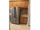Kitchen boasts stainless steel refrigerator and ample wood cabinetry at 2470 Salzburg Loop, Winter Haven, FL 33884