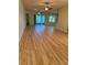 Open living room with hardwood floors and ceiling fans at 2470 Salzburg Loop, Winter Haven, FL 33884