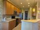 Bright kitchen with wood cabinets, stainless steel appliances, and tile flooring at 2470 Salzburg Loop, Winter Haven, FL 33884