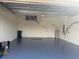 Attached garage with high ceilings and painted floor at 2470 Salzburg Loop, Winter Haven, FL 33884