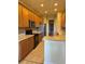 Bright kitchen with wood cabinets, stainless steel appliances, and tile flooring at 2470 Salzburg Loop, Winter Haven, FL 33884
