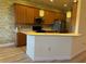 Modern kitchen with wood cabinets and a large island at 2470 Salzburg Loop, Winter Haven, FL 33884