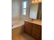 Bathroom with soaking tub, vanity, and shower at 2470 Salzburg Loop, Winter Haven, FL 33884