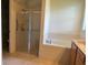 Bathroom with shower and garden tub at 2470 Salzburg Loop, Winter Haven, FL 33884