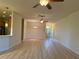 Bright living room featuring hardwood floors and ceiling fans at 2470 Salzburg Loop, Winter Haven, FL 33884