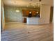 Kitchen with wood cabinets, granite countertops, and breakfast bar at 2470 Salzburg Loop, Winter Haven, FL 33884