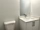 Bathroom vanity with a modern white cabinet and quartz countertop at 1312 Hillsborough Ct, Poinciana, FL 34759