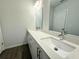 Double vanity bathroom with modern fixtures and quartz countertop at 1312 Hillsborough Ct, Poinciana, FL 34759