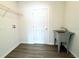 Laundry room with utility sink, shelving and vinyl flooring at 1312 Hillsborough Ct, Poinciana, FL 34759