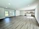 Spacious living room with open floor plan and kitchen view at 1312 Hillsborough Ct, Poinciana, FL 34759
