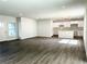 Spacious living room with open floor plan and kitchen view at 1312 Hillsborough Ct, Poinciana, FL 34759