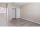 Simple bedroom with wood-look floors and a spacious closet at 1526 Pier St, Clermont, FL 34711