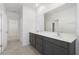 Double vanity bathroom with a large mirror and closet at 1459 Alston Bay Blvd, Apopka, FL 32703