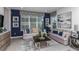 Spacious living room with gray sofas and blue accents at 1455 Alston Bay Blvd, Apopka, FL 32703