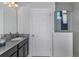 Bathroom with single vanity, dark cabinets and shower at 1455 Alston Bay Blvd, Apopka, FL 32703