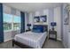 Bedroom with blue and gray color scheme and a comfortable bed at 1455 Alston Bay Blvd, Apopka, FL 32703