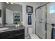 Bathroom with a walk-in shower, toilet, and vanity with a gray countertop at 1455 Alston Bay Blvd, Apopka, FL 32703