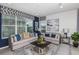 Spacious living room with gray sofas and blue accents at 1455 Alston Bay Blvd, Apopka, FL 32703