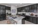 Kitchen island with seating, stainless steel appliances, and granite countertop at 1455 Alston Bay Blvd, Apopka, FL 32703