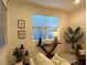 Living area with large windows and stylish decor at 1436 Silver Lining Way, Apopka, FL 32703
