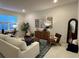 Living room with cozy seating and large windows at 1436 Silver Lining Way, Apopka, FL 32703