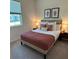 Cozy bedroom with a comfortable bed and stylish decor at 1436 Silver Lining Way, Apopka, FL 32703