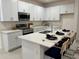 Modern kitchen with stainless steel appliances and island at 1436 Silver Lining Way, Apopka, FL 32703