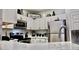 Modern kitchen with stainless steel appliances and white cabinets at 1990 Erving Cir # 201, Ocoee, FL 34761