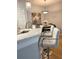 Kitchen island with white quartz countertop and seating for two at 1990 Erving Cir # 201, Ocoee, FL 34761