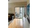 Living room with sliding glass doors leading to a balcony at 1990 Erving Cir # 201, Ocoee, FL 34761