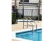 Community hot tub with handrails next to pool at 1990 Erving Cir # 201, Ocoee, FL 34761