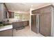 Modern kitchen with stainless steel appliances and an island at 11188 Hess Way, Oxford, FL 34484