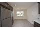 Modern kitchen with stainless steel appliances and ample cabinet space at 11188 Hess Way, Oxford, FL 34484